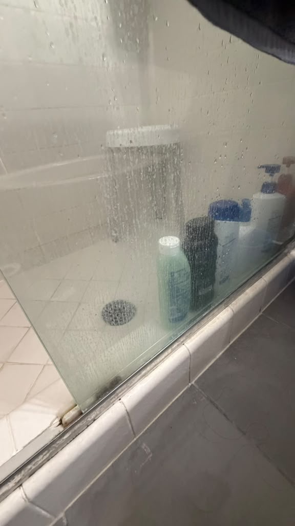 Shower glass door before cleaning
