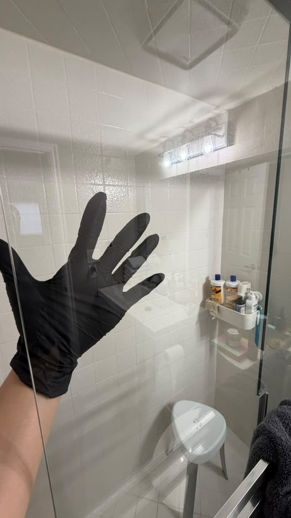 Shower glass door after cleaning — crystal clear, streak-free