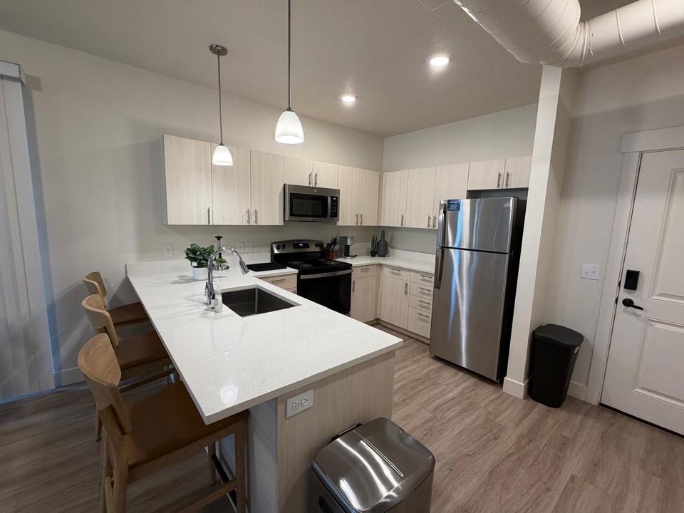 Empty apartment kitchen cleaned and ready for move-in